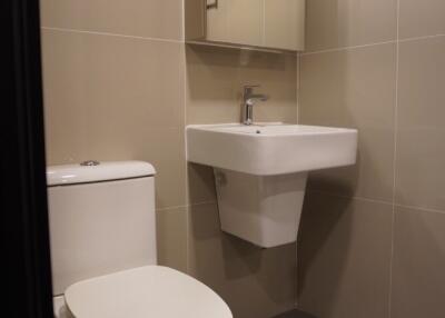 Modern bathroom with wall-mounted sink and toilet