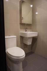 Modern bathroom with wall-mounted sink and toilet