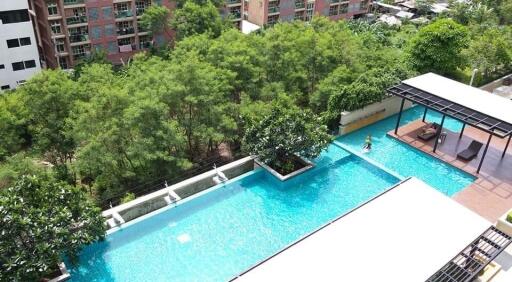 Aerial view of a swimming pool area in an apartment complex