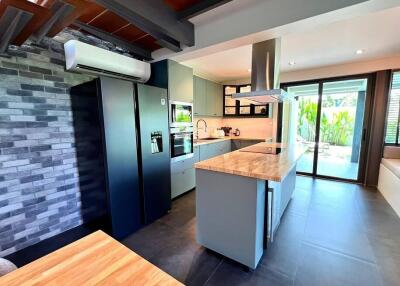 Modern kitchen with island and outdoor view