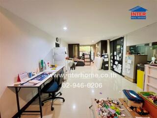 Living room with dining area and study space