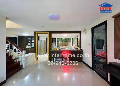 Modern kitchen and dining area with staircase