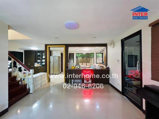 Modern kitchen and dining area with staircase