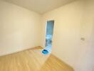 Empty bedroom with doorway to a bathroom