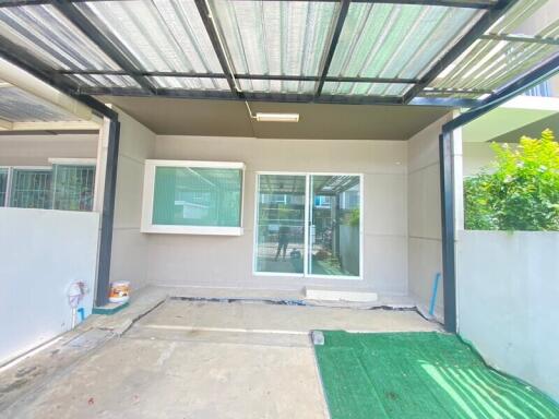 Covered patio with sliding glass doors