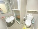 Modern bathroom with sink, toilet, and shower area