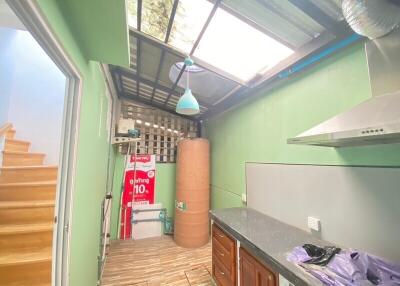 Small kitchen area with skylight