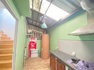 Small kitchen area with skylight