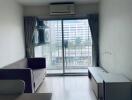 Living room with sliding glass door and city view