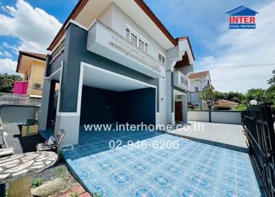 Front view of a house with a driveway and garage