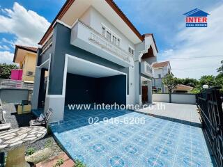 Front view of a house with a driveway and garage