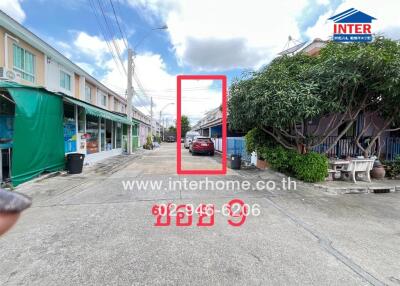 Street view of residential area with houses and cars