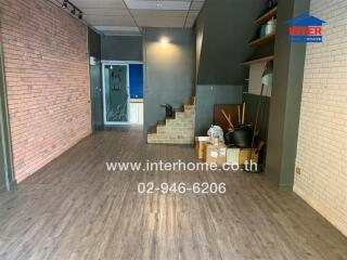 Spacious main living area with wooden flooring and modern design.