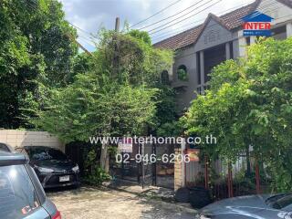 Exterior view of a residential building with greenery