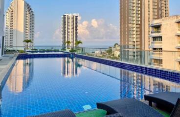 Rooftop pool area with scenic city view