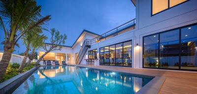 Modern luxury house with pool at dusk