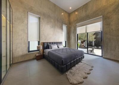 Modern bedroom with large windows and stylish decor