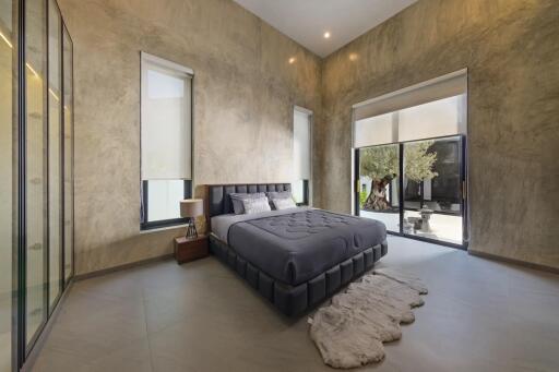 Modern bedroom with large windows and stylish decor