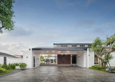 Modern house exterior with driveway and greenery