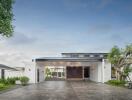 Modern house exterior with driveway and greenery