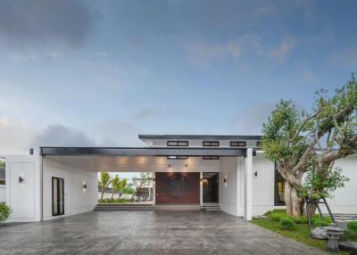 Modern house exterior with driveway and garden