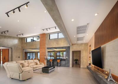 Spacious modern living room with high ceiling and stylish decor