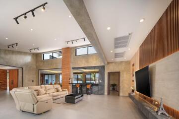 Spacious modern living room with high ceiling and stylish decor