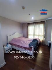 Bedroom with a double bed and bedside table