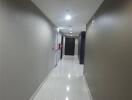 Hallway with white tile flooring and beige walls