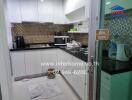 Modern kitchen with appliances and mosaic tile backsplash