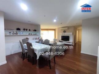 Modern living and dining area with wooden flooring