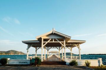 A beautiful pavilion overlooking the sea with a walkway