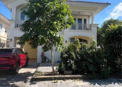 Exterior view of a two-story house with driveway