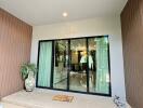 Entrance with sliding glass door and potted plants