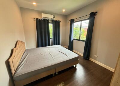 Modern bedroom with bed and windows