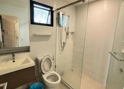 Modern bathroom with a glass shower partition