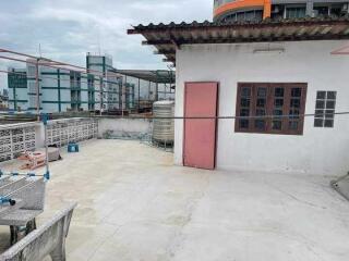 Rooftop with surrounding urban view