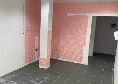 Empty kitchen with tiled walls and flooring