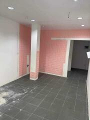 Empty kitchen with tiled walls and flooring