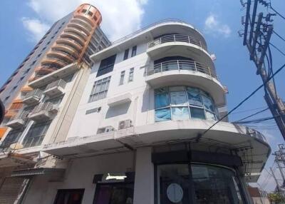 Exterior view of a modern building with multiple floors and large windows