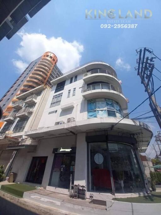 Exterior view of a modern building with multiple floors and large windows