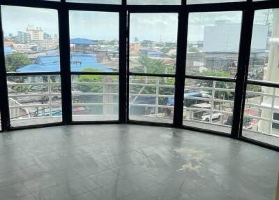 Bright living room with large windows and city view