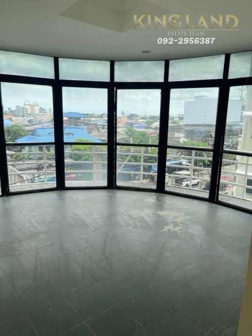 Bright living room with large windows and city view