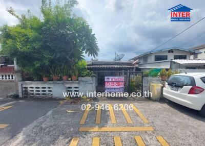 Exterior view of a residential property with parking space