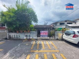 Exterior view of a residential property with parking space