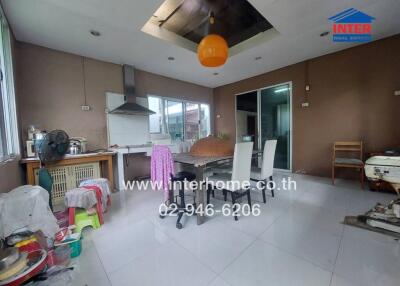 Spacious kitchen with dining area and modern amenities