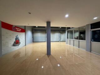 Spacious commercial space with polished floors and large windows