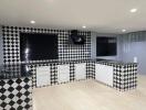 Modern kitchen with black and white checkered tiles