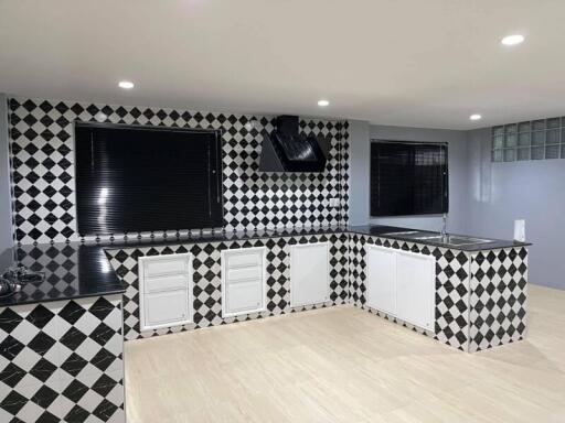 Modern kitchen with black and white checkered tiles