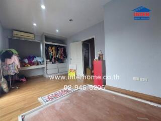 Bedroom with wooden floors and built-in wardrobe